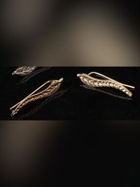 Gold-tone feather earrings with Clear Grip Bumpers